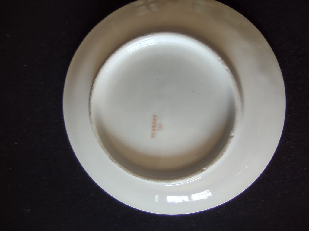 Hand-painted peaches plate close-up of rim edge profile showing clean unchipped white porcelain edge with no chips or cracks