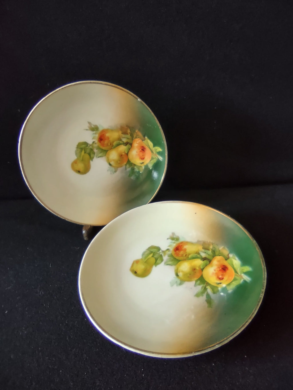 Vintage hand-painted pears porcelain plate set of 2 front view both plates showing golden yellow pears on cream to teal green graduated ground with silver rim