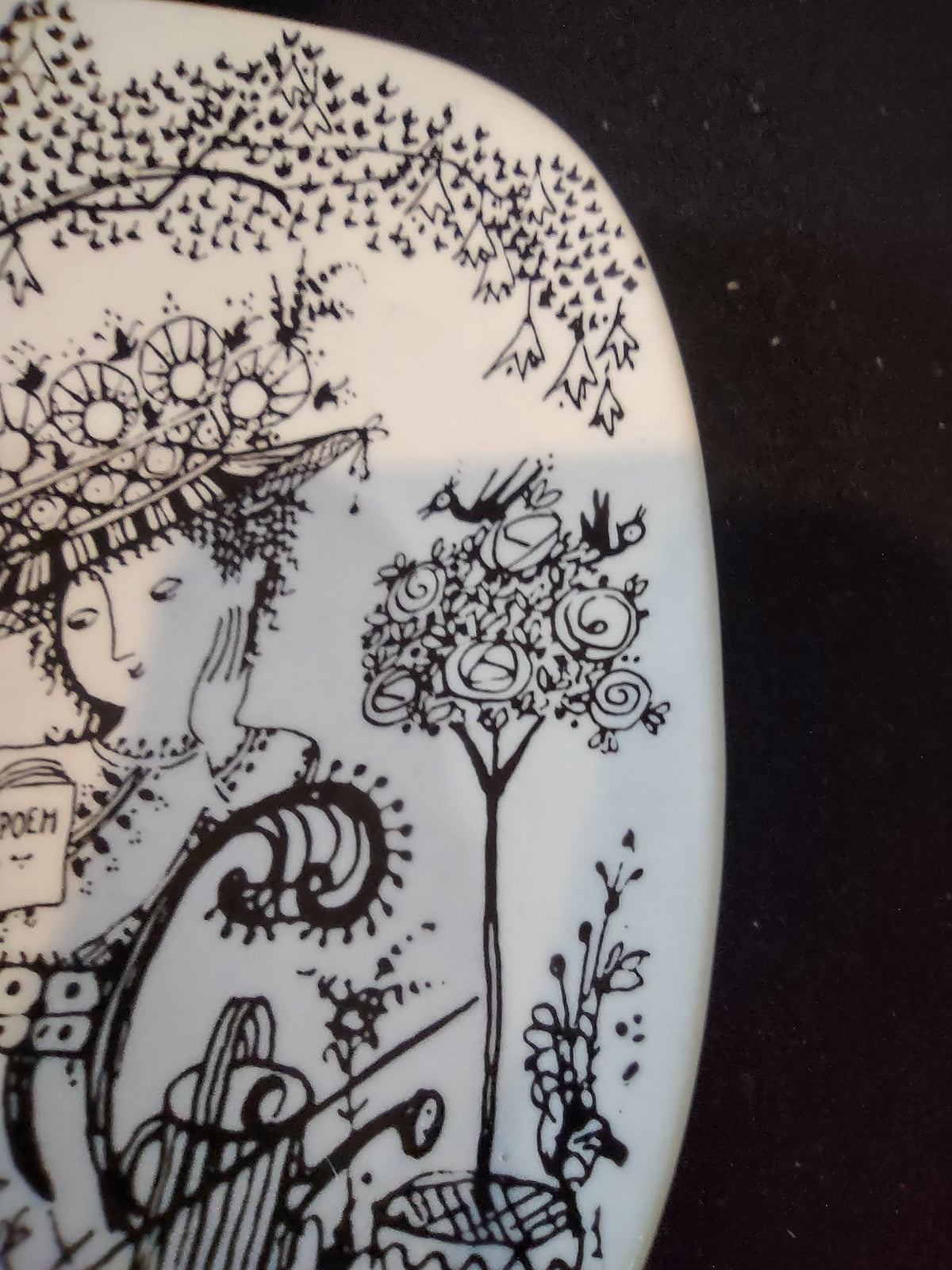Rosenthal Wiinblad Fiesta plate angled view from upper left showing full composition tree branches garden lattice ground and rounded square corner profile