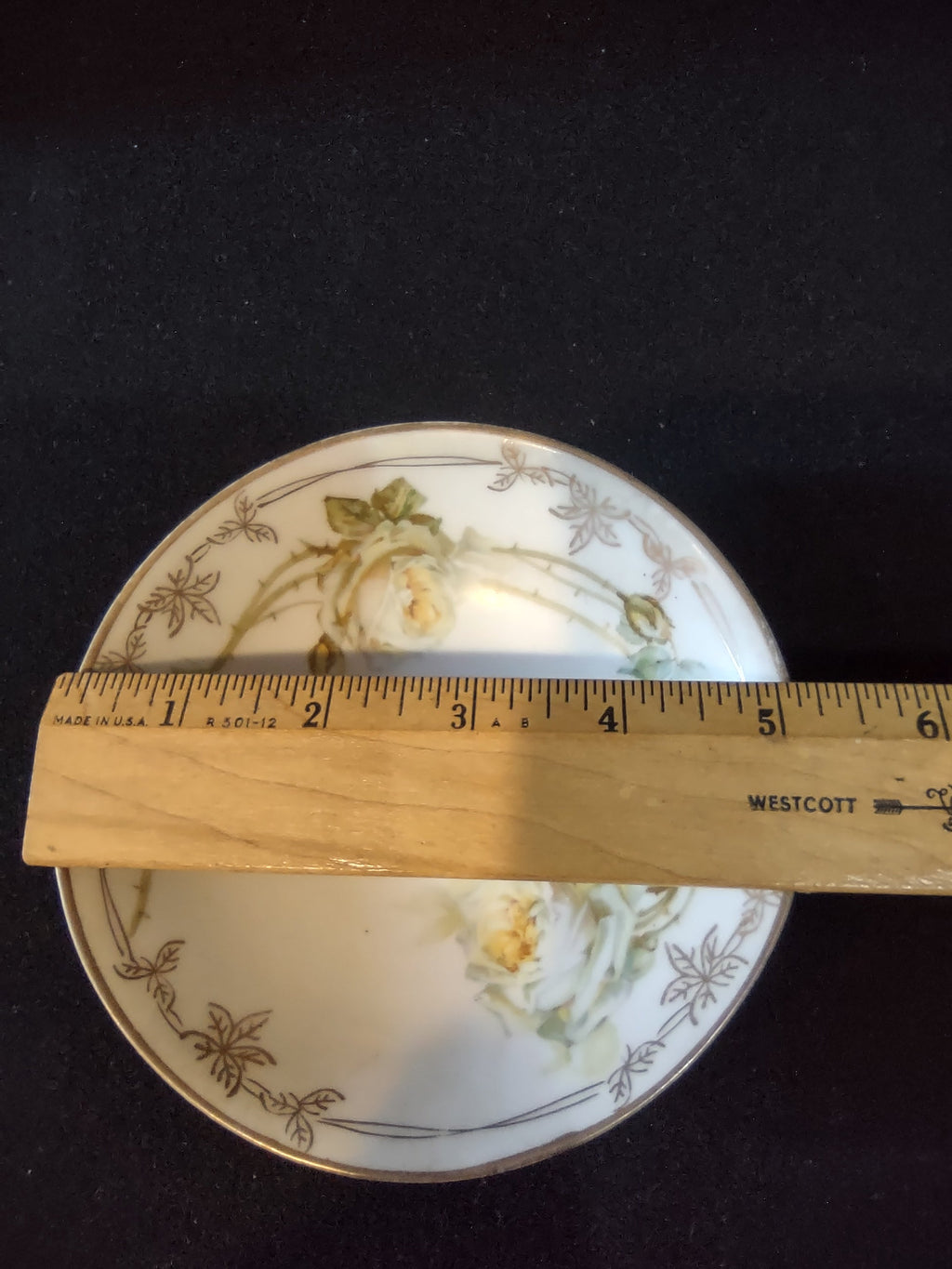 C Tielsch Altwasser round plate with ruler showing approximately 5.5 inch diameter cream roses gold border pattern on white porcelain