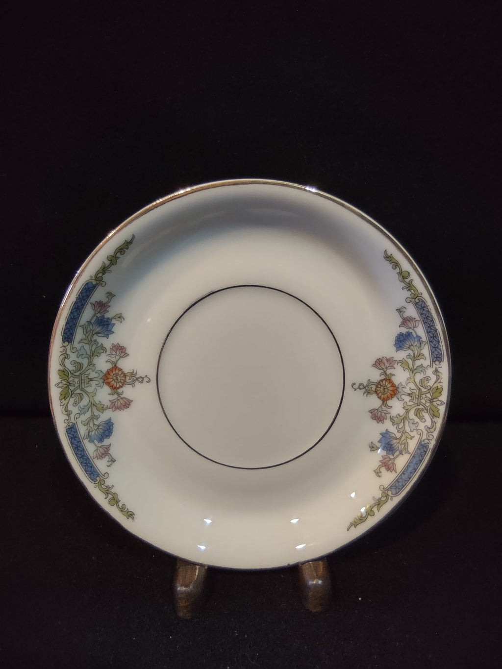 Vintage Hutschenreuther Selb Bavaria saucer top view with ruler showing approximately 5.5 inch diameter blue bellflower orange chrysanthemum gold acanthus border on white ground