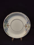 Vintage Hutschenreuther Selb Bavaria saucer top view with ruler showing approximately 5.5 inch diameter blue bellflower orange chrysanthemum gold acanthus border on white ground