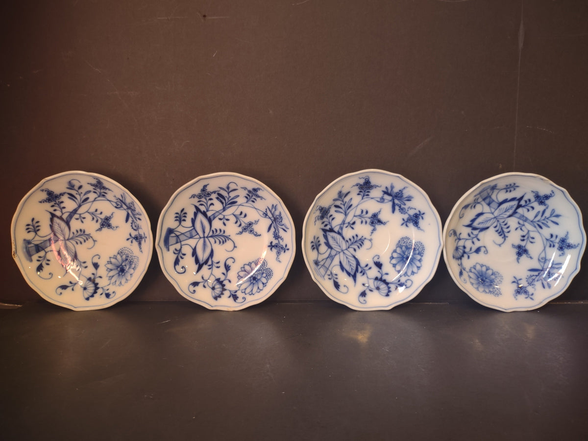 Blue Onion butter pat saucers with ruler showing approximately 4 inches