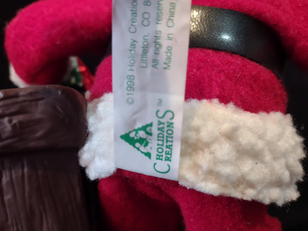 Vintage Holiday Creations Santa with dog and fireplace figurine, front view