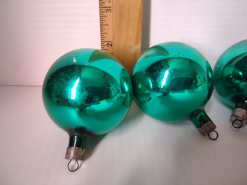 Set of three vintage teal green shiny glass ball Christmas ornaments lined up