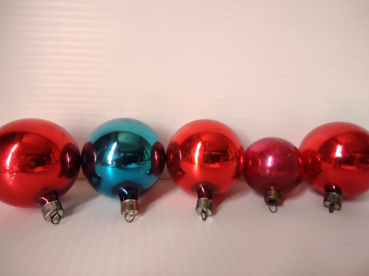 Three vintage Premier red glass ball Christmas ornaments with metal caps and wire hangers