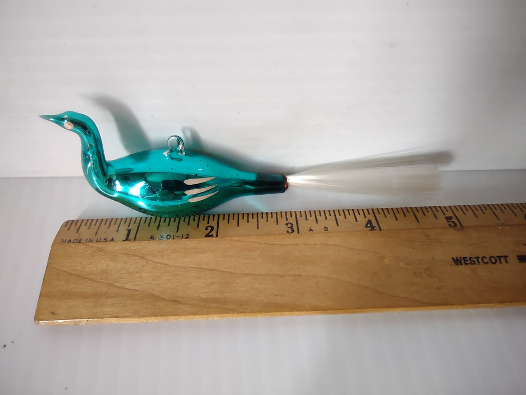 Vintage teal glass bird swan Christmas ornament with spun glass fiber tail next to ruler showing approximately 4 to 4.5 inch body length