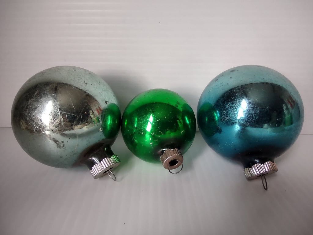 Set of 3 vintage Shiny Brite glass ball ornaments in silver, green, and teal with ribbed metal caps