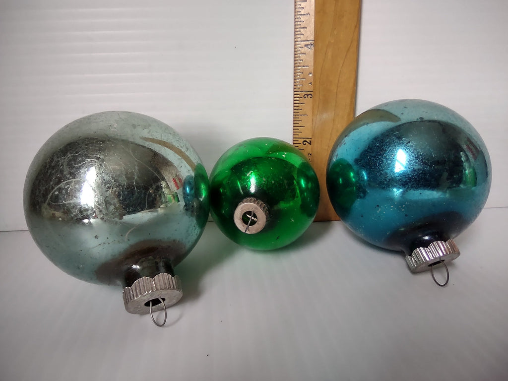 Three Shiny Brite glass ball ornaments next to ruler showing approximately 2 to 3.5 inch sizes