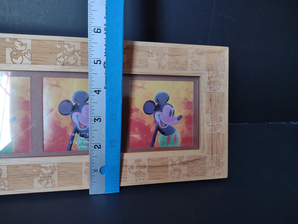 Side view of Disney Mickey Mouse carved wood triple photo frame with ruler showing approximately 5 inches tall