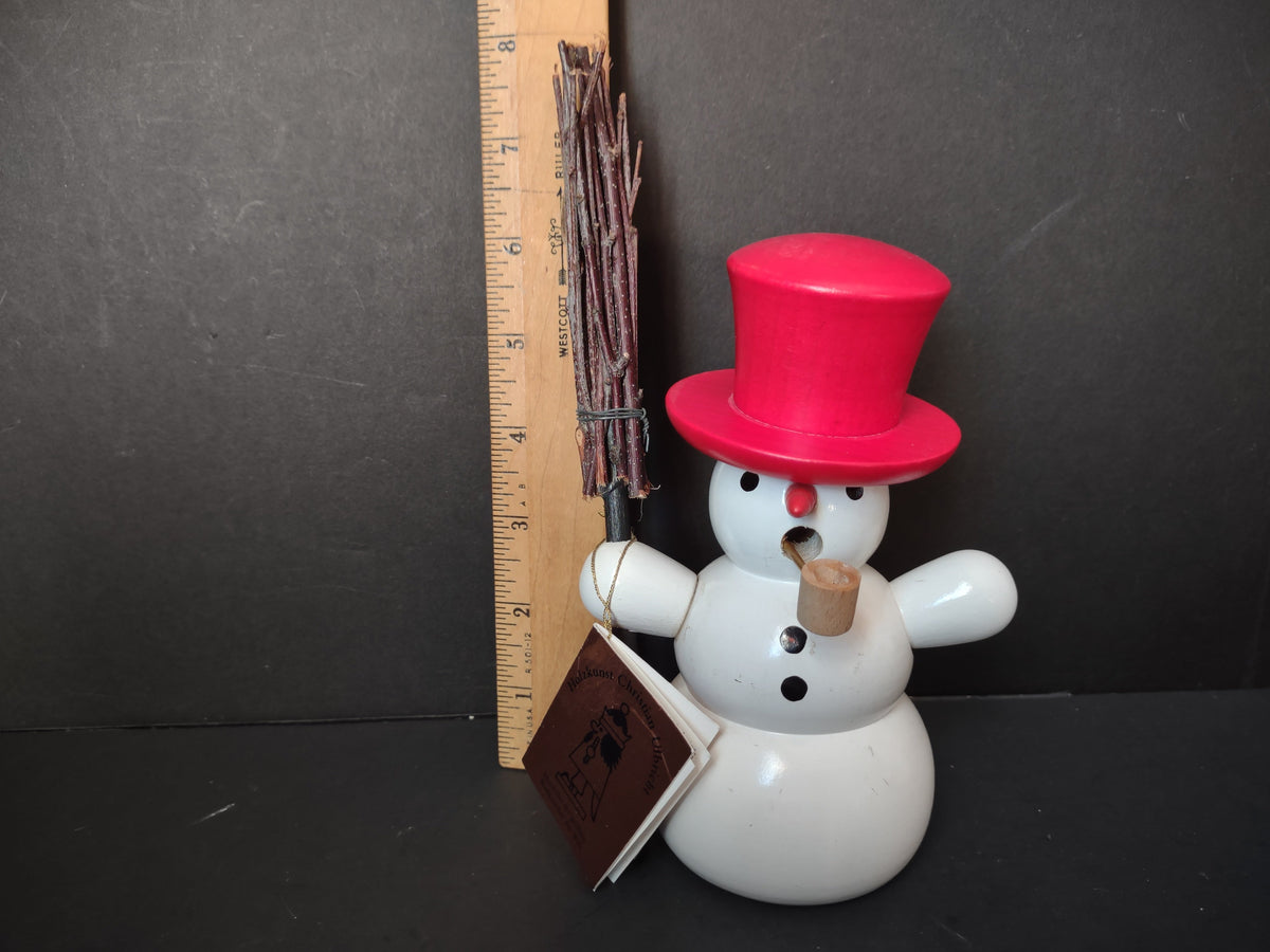 Vintage Christian Ulbricht German wooden snowman figurine with red top hat and twig broom, shown with ruler for scale