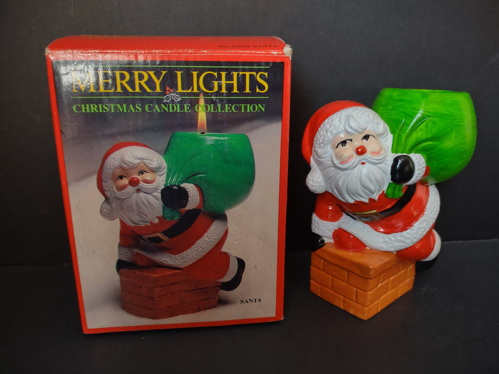 Vintage Merry Lights Santa ceramic candle holder displayed next to its original red box
