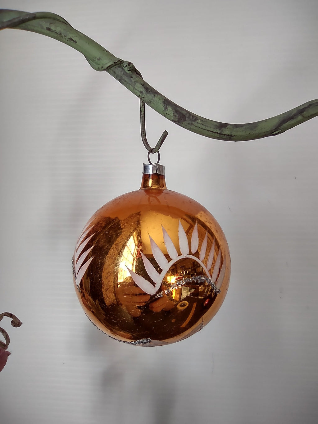 Vintage West German copper amber glass ball ornament with stencil leaf decoration, size reference