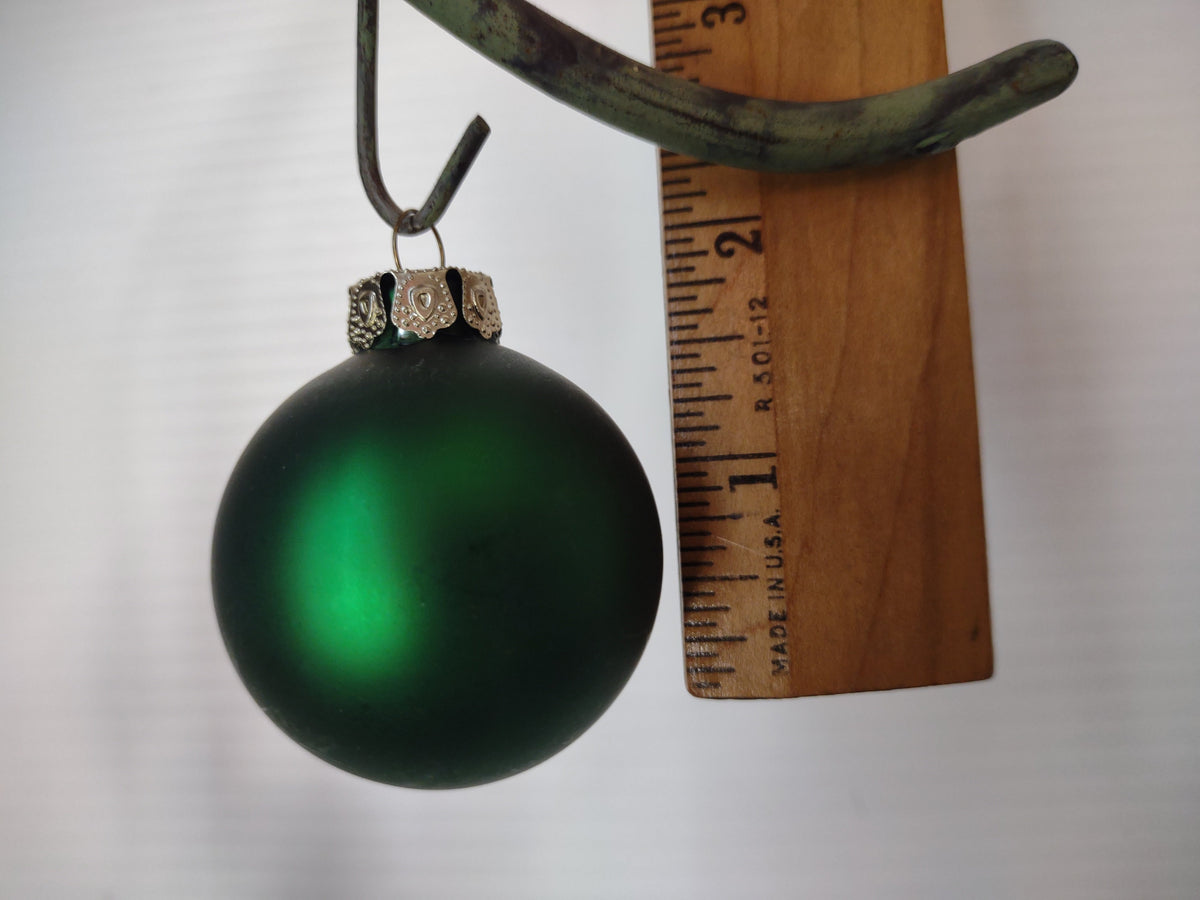 Vintage matte forest green glass ball ornament size reference, approx 2 inch diameter