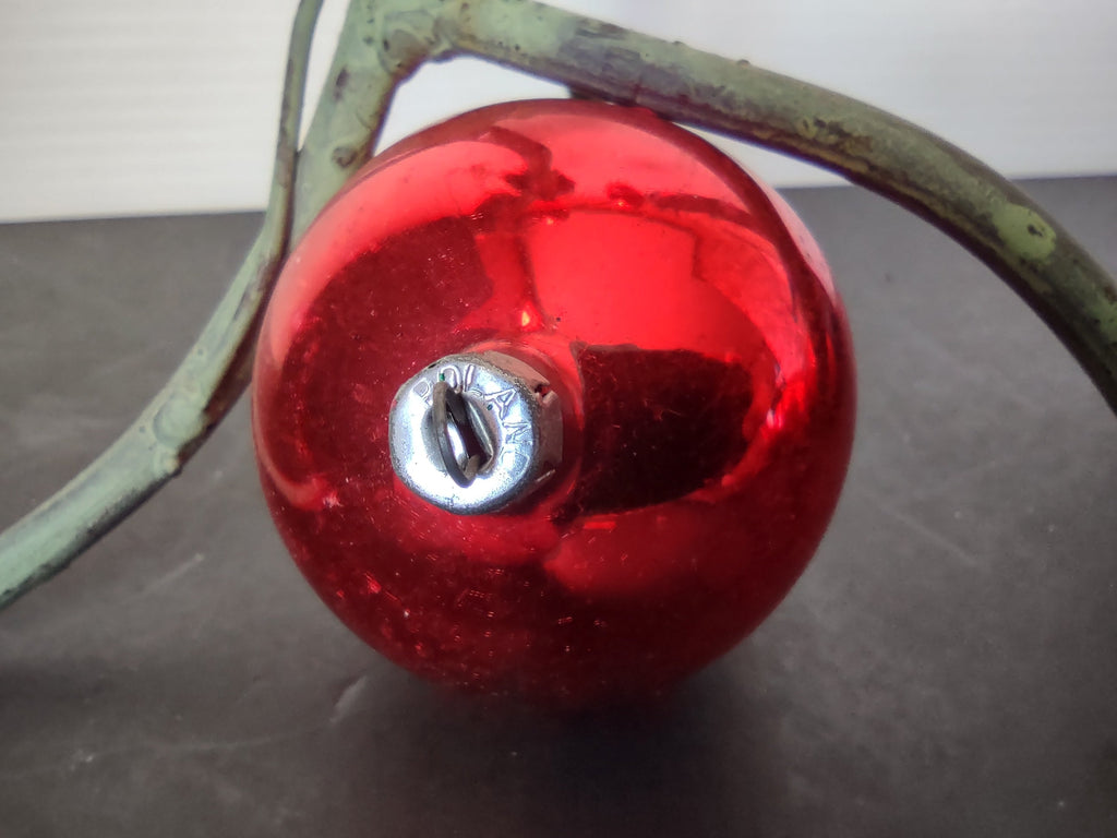 Two vintage red glass ball ornaments with ruler showing approx 2.5 inch diameter