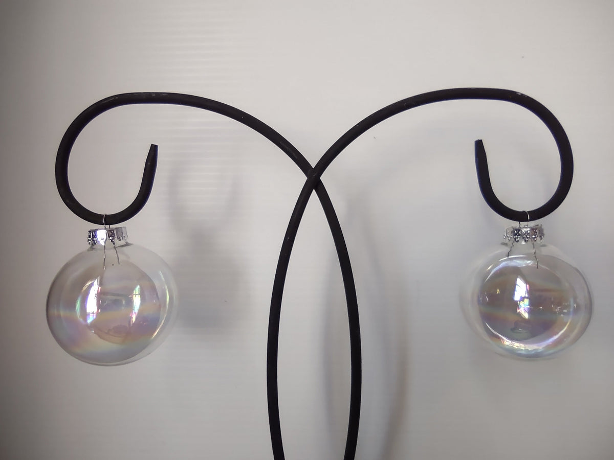 Vintage iridescent clear glass ball ornament with ruler showing approx 2 inch diameter