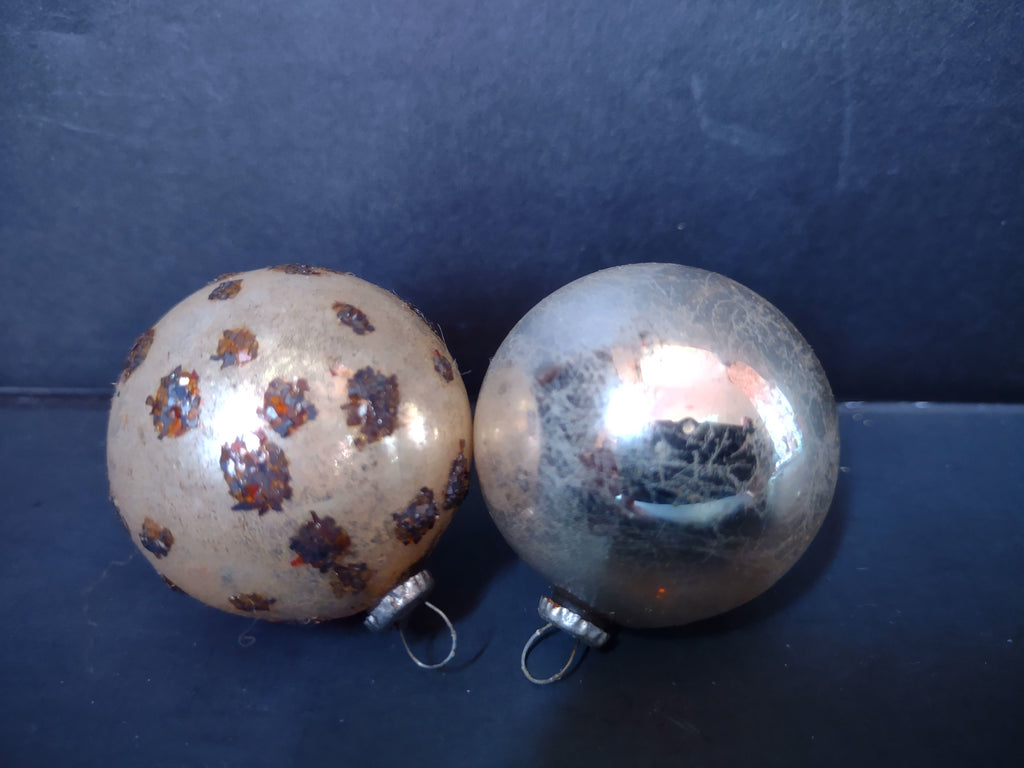 Two vintage Japan mercury glass ball ornaments, gold with dark spot decoration and silver with crackle mica finish
