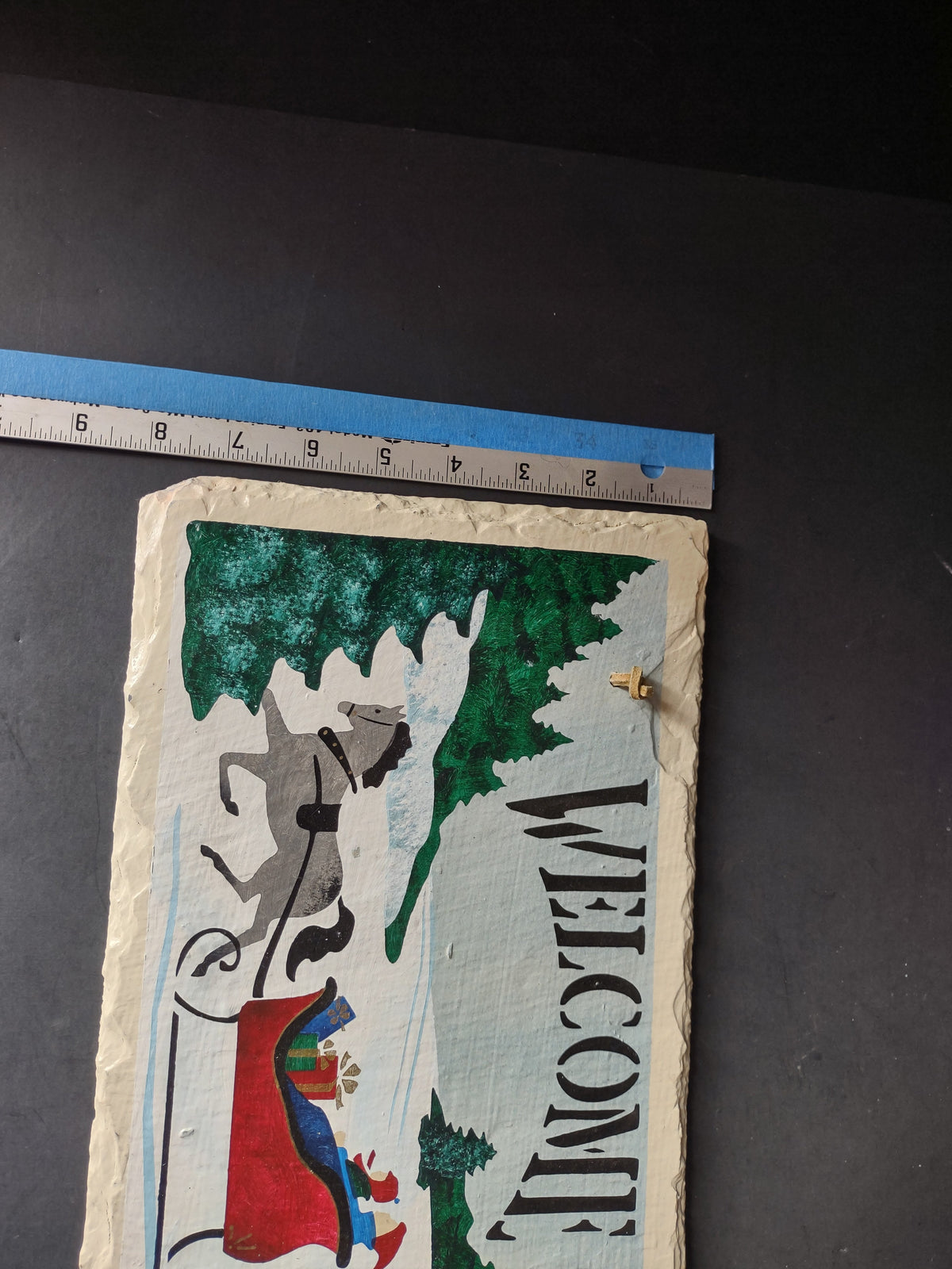 Vintage painted slate welcome sign horse sleigh winter scene, angled front view