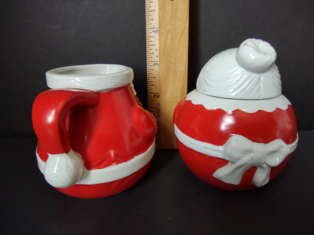 Avon 1983 Santa and Mrs Claus creamer and sugar bowl backstamps showing copyright AVON 1983