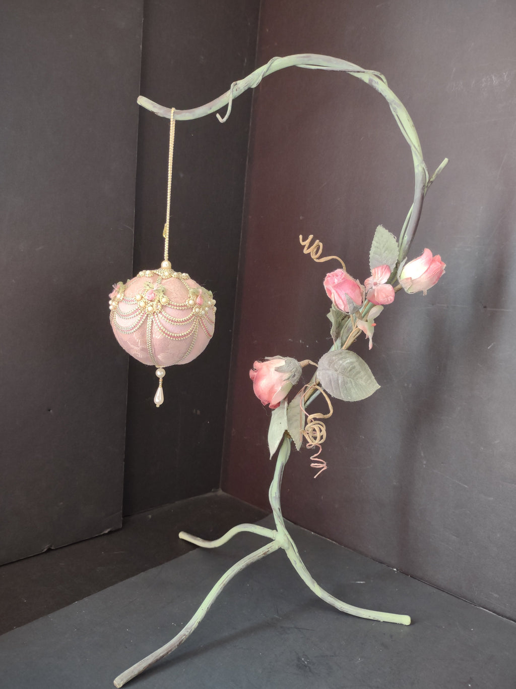 Vintage pink velvet ball ornament with pearl swags and ribbon roses with ruler for scale