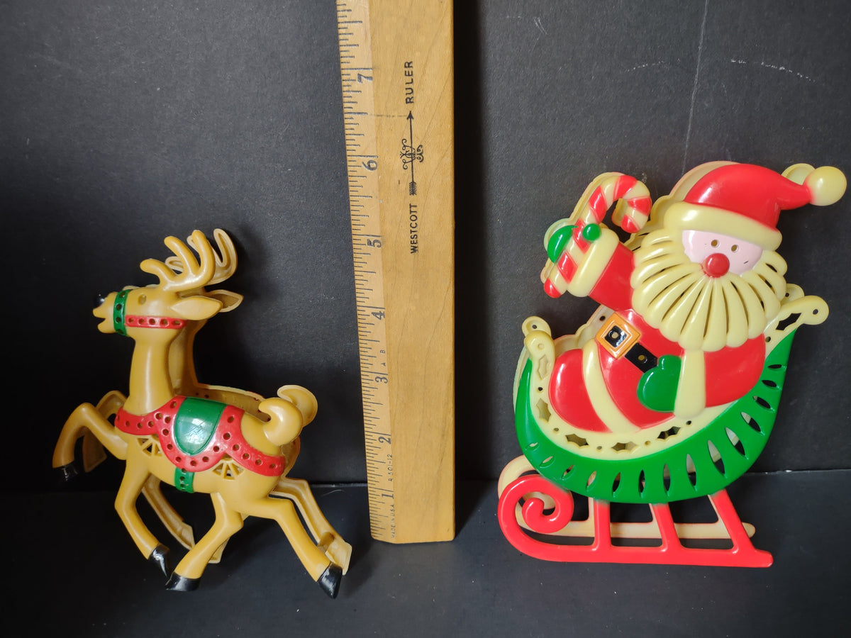 Vintage Santa sleigh and reindeer plastic figures approximately 5-6 inches tall