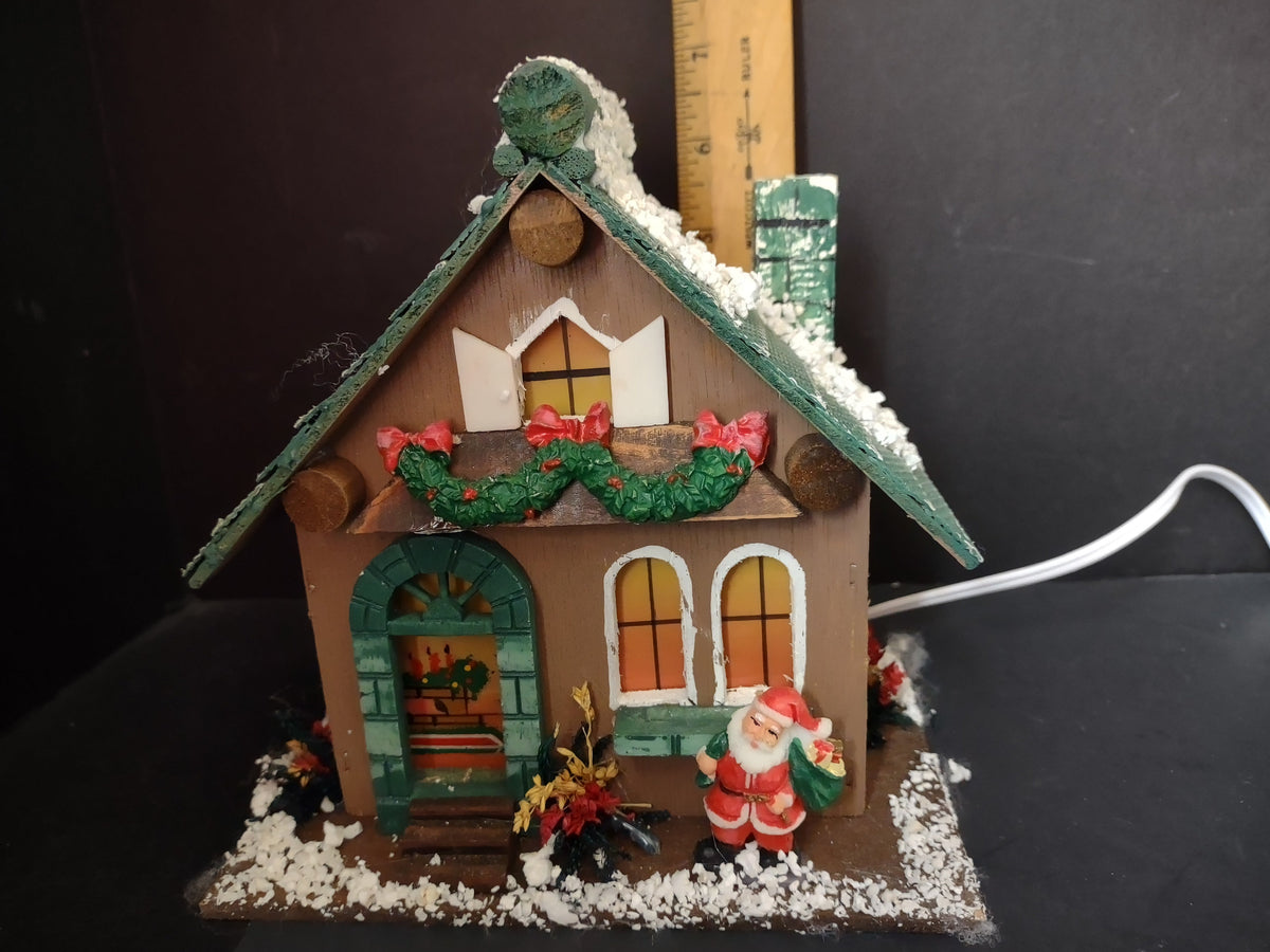 Vintage lighted wood Christmas village house side view with ruler showing approximately 9 inch height