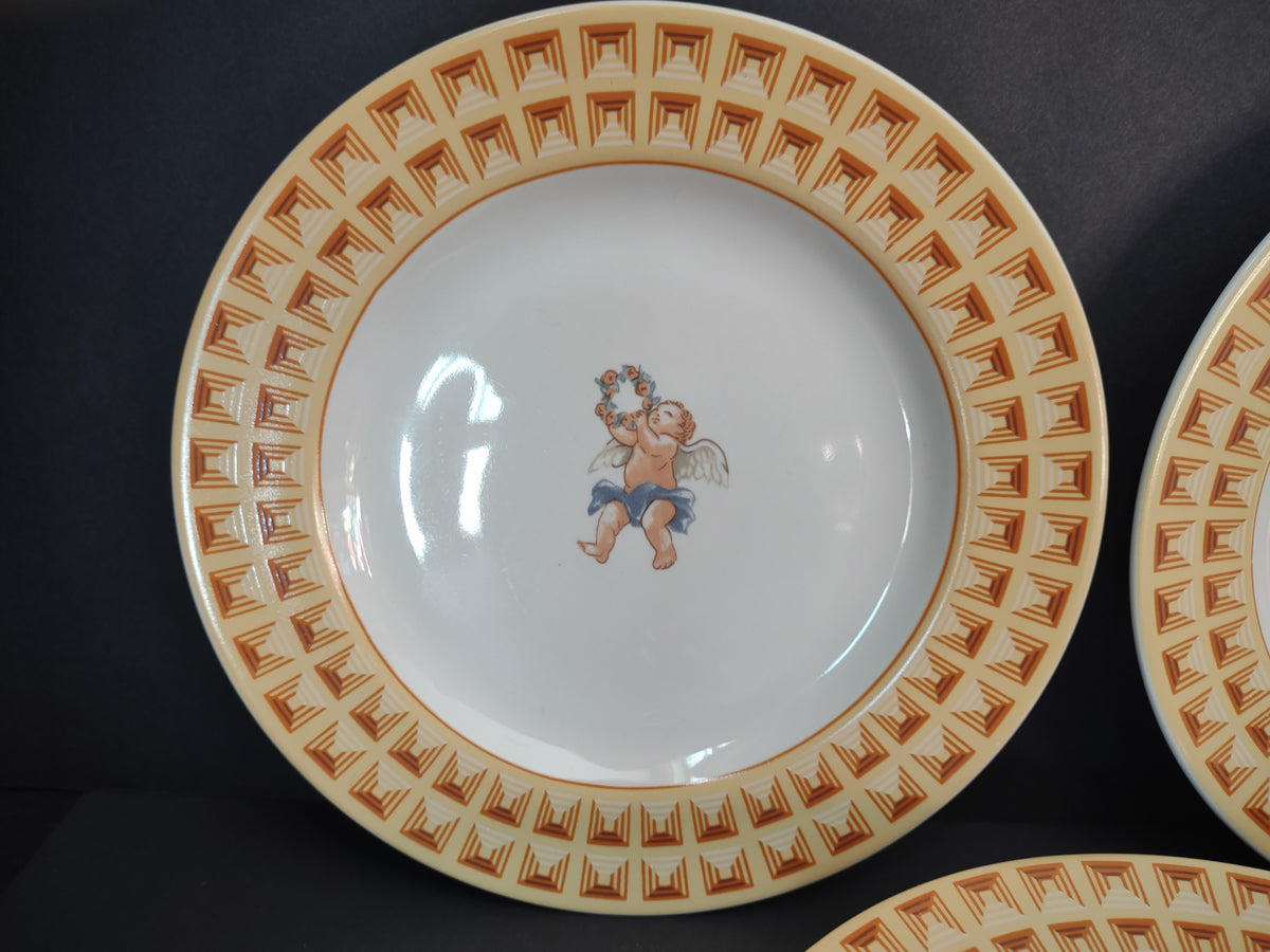 Cherub plate with yellow and brown geometric border