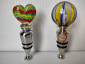 Pair of colorful heart and globe glass wine bottle stoppers