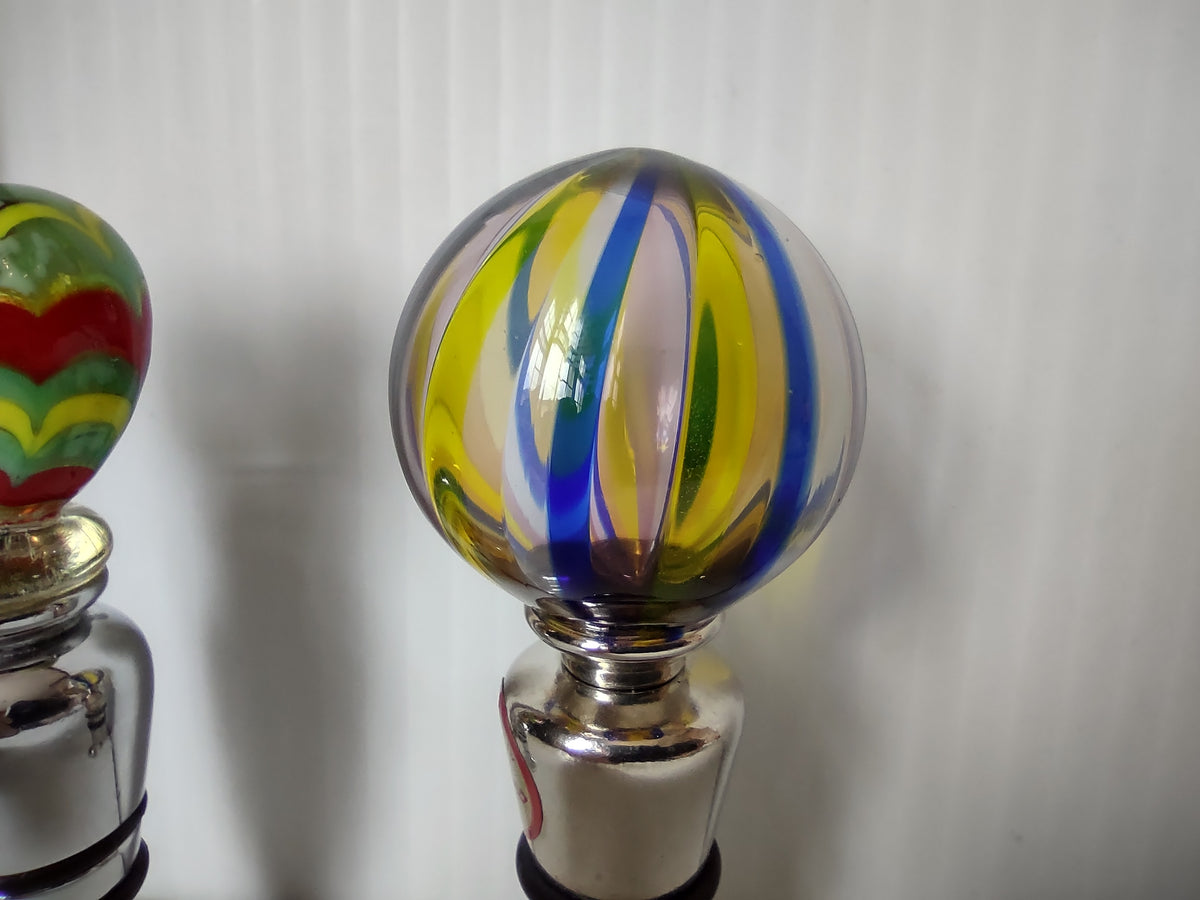 Close-up of striped blue yellow lavender globe glass top