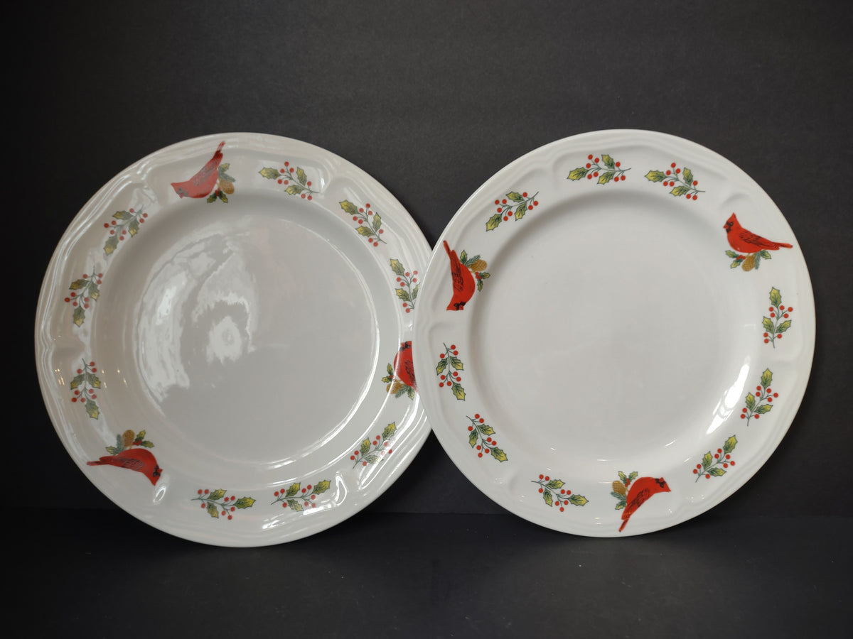 Pair of white Gibson plate pieces decorated with red cardinals and green holly