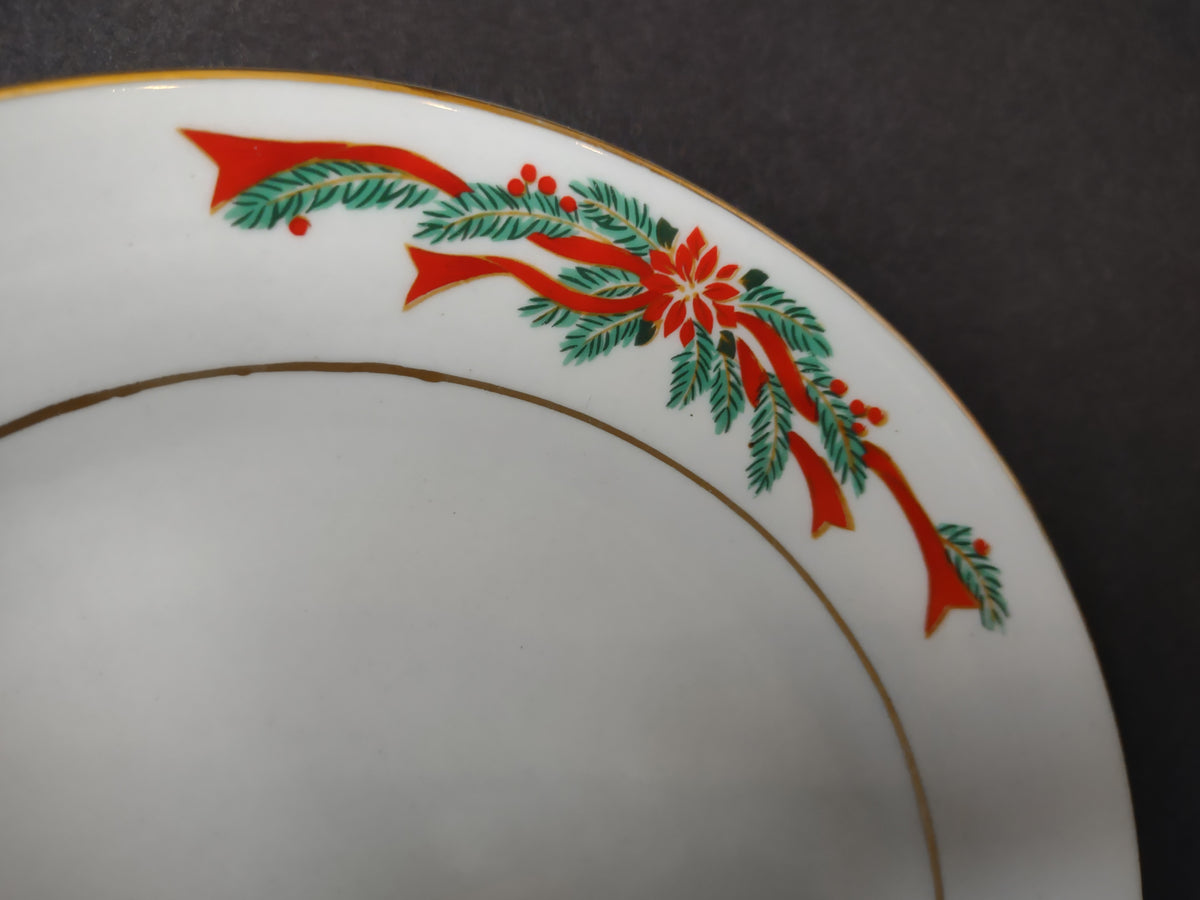 Red poinsettia ribbon green foliage and gold border detail