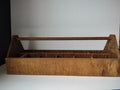 Overhead view of wooden carrier compartments with length ruler