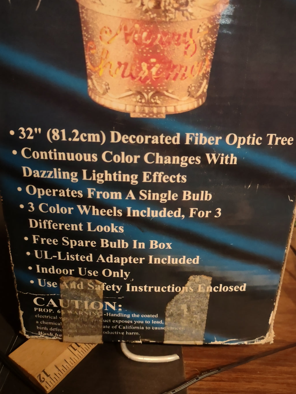 Vintage fiber optic Christmas tree box showing 32-inch height specifications and box wear