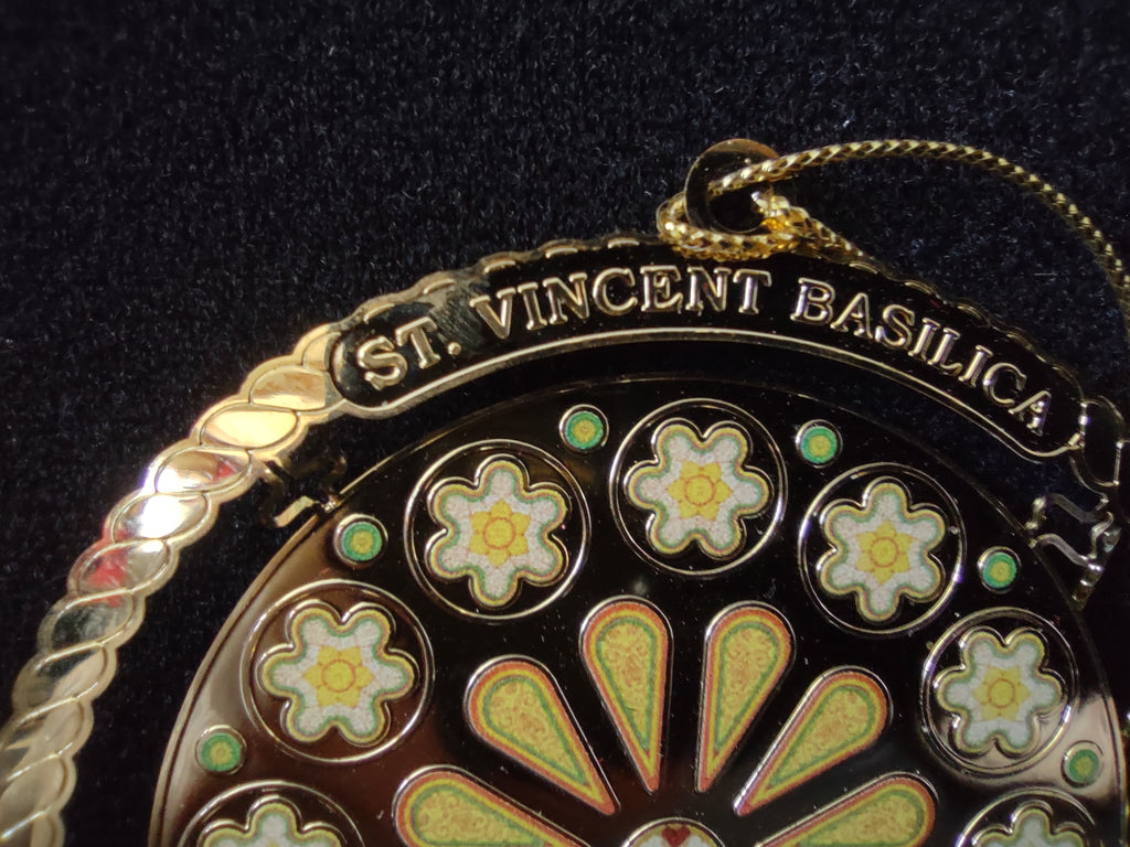 Ornament photographed beside an inch ruler