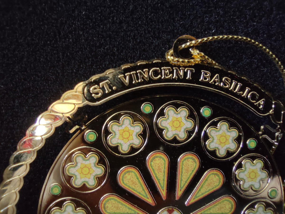 Ornament photographed beside an inch ruler