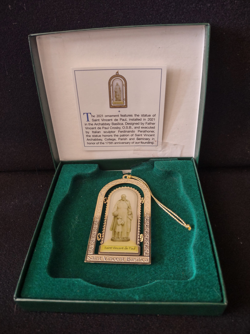 Ornament in its original green gift box with the 2021 story card