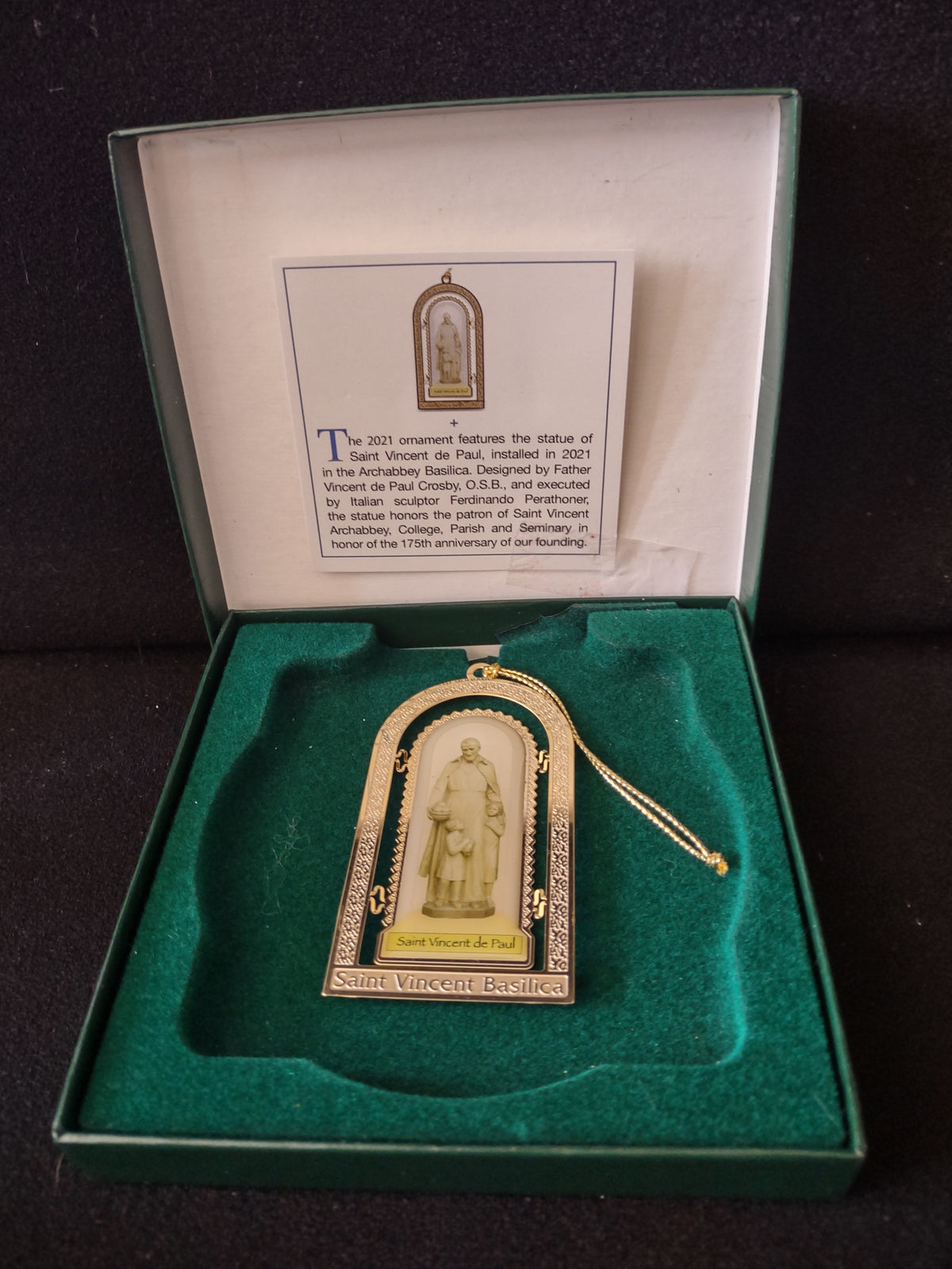 Ornament in its original green gift box with the 2021 story card