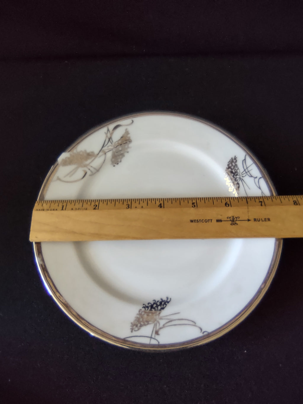 White glaze and gold floral rim detail