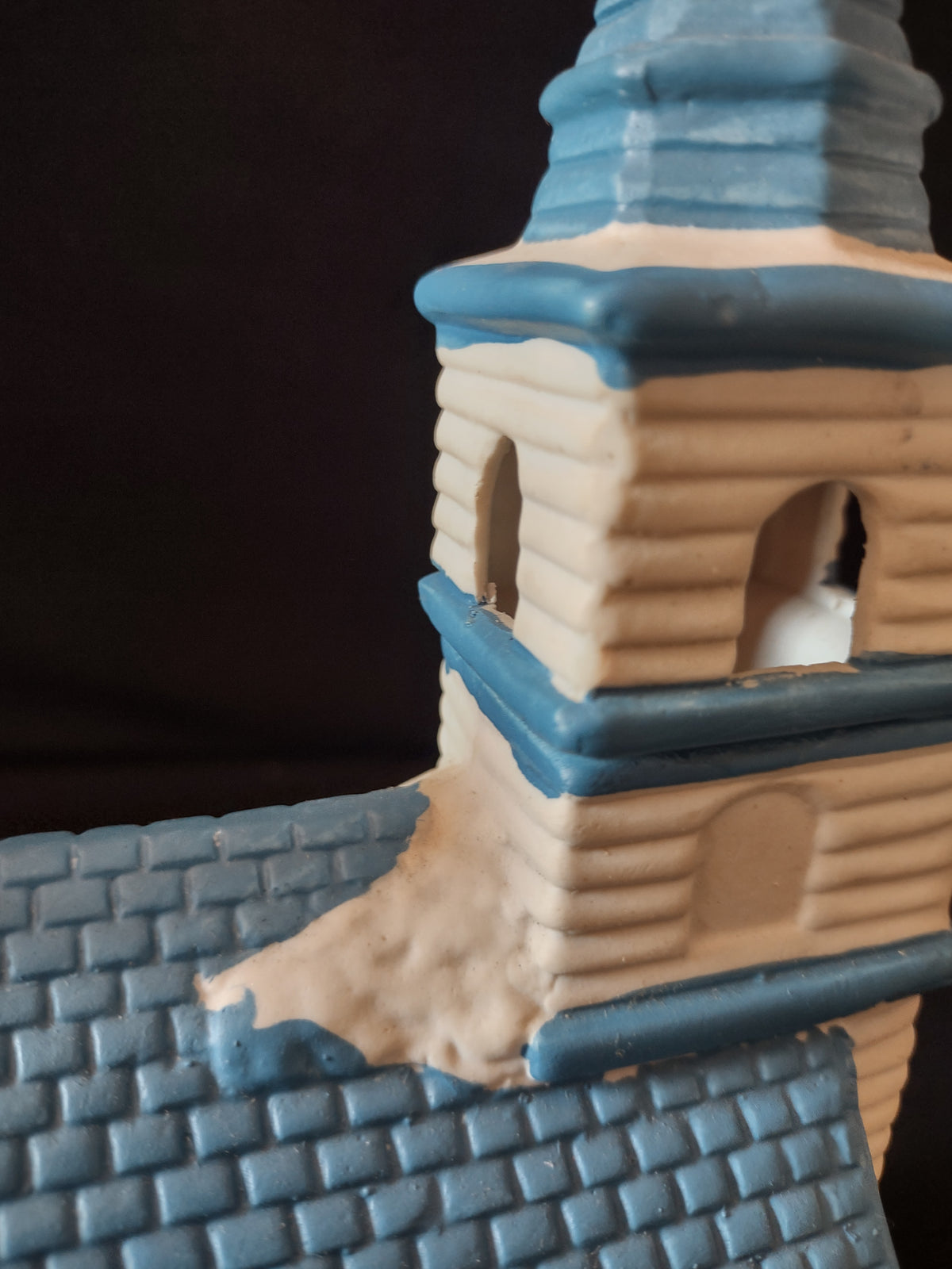 Close-up of blue church steeple and clock