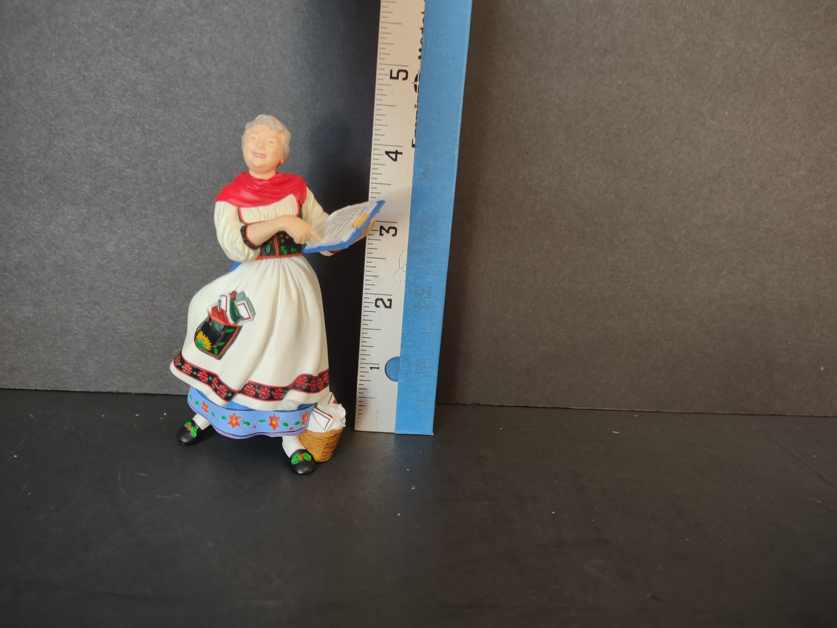 Mrs Claus ornament beside ruler showing approximate height