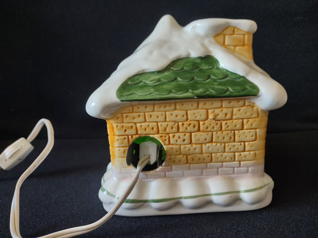 Yellow brick side with illuminated window