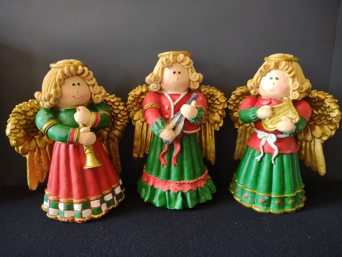 Set of three red green and gold Christmas angel musician figurines
