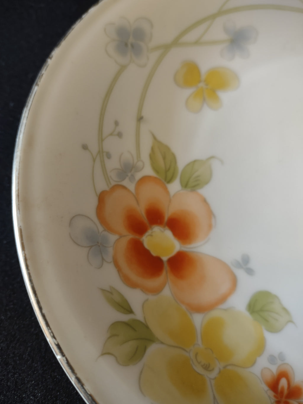 Floral detail and metallic rim wear