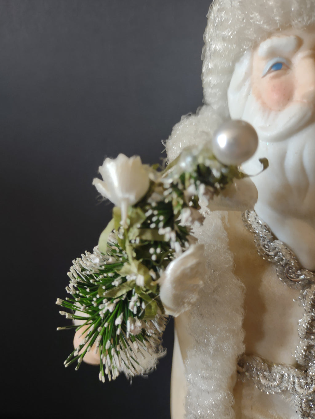 Close-up of greenery and white floral details