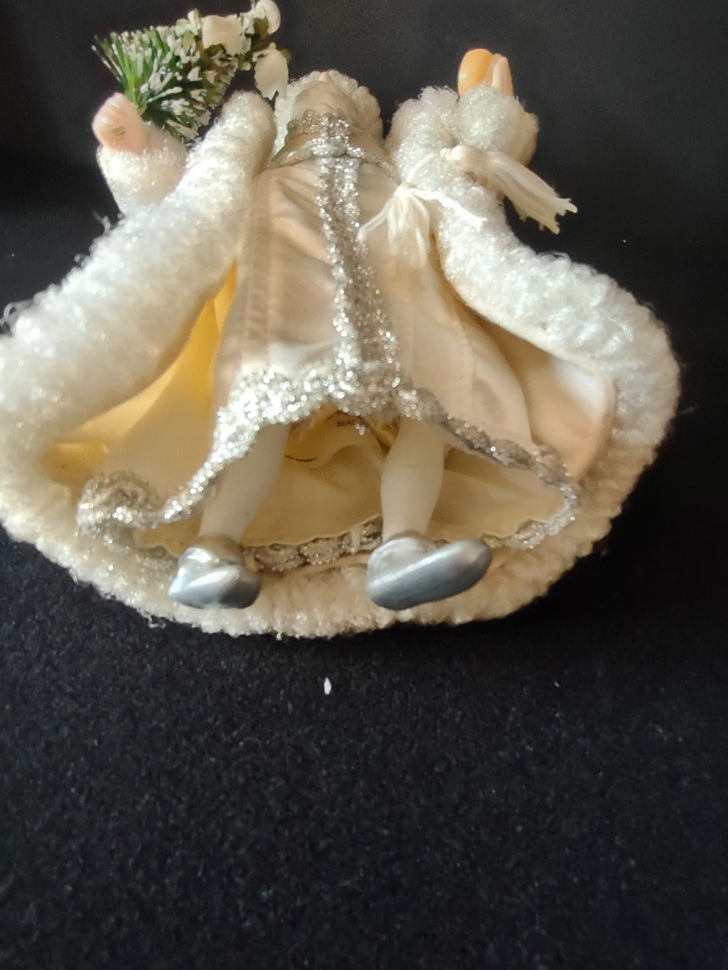 Underside of Santa ornament with silver shoes
