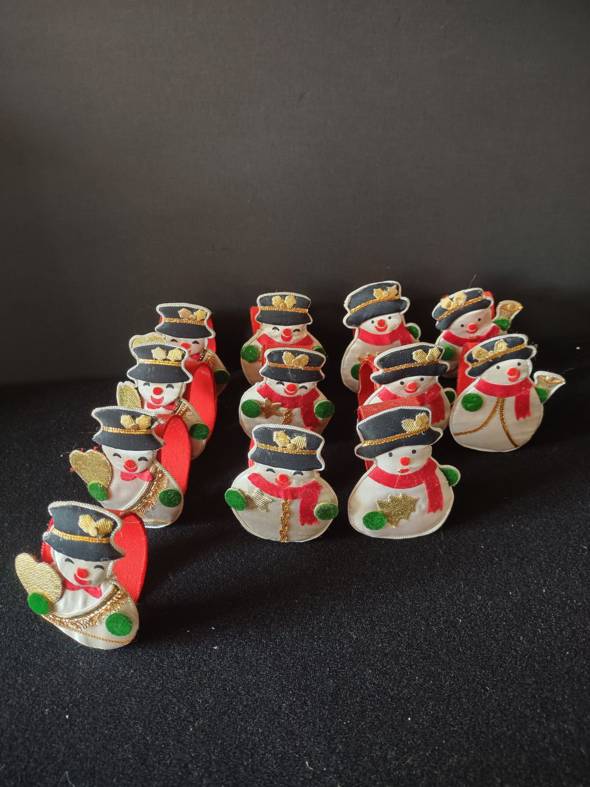 Snowman napkin rings with red scarves and green mittens