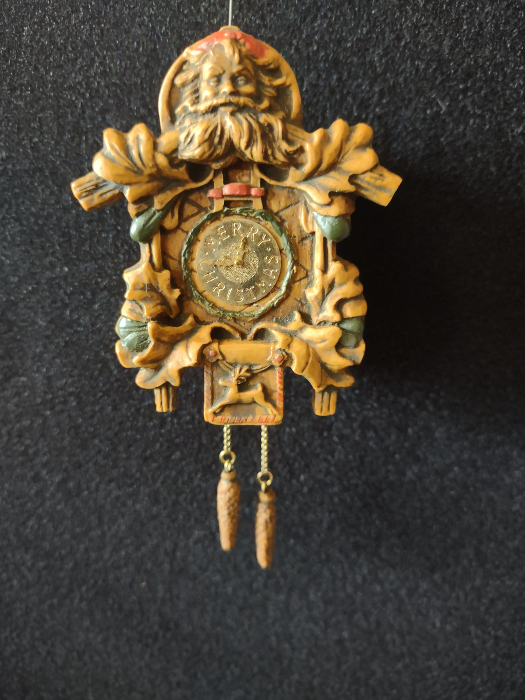 Deer motif and two dangling pinecone-style weights