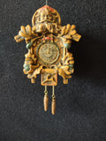 Deer motif and two dangling pinecone-style weights