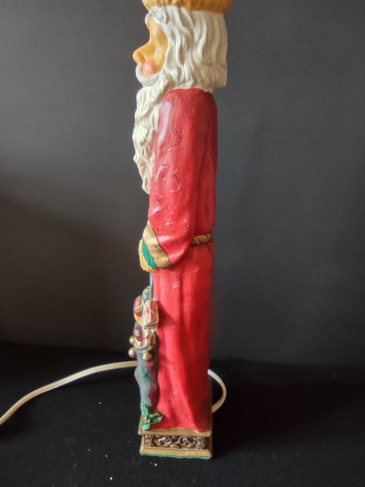 Santa Claus Christmas candle lamp shown illuminated