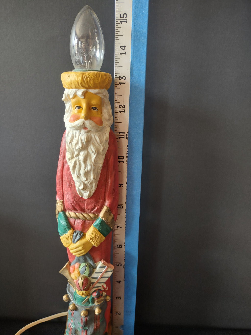 Side view of Santa electric candle lamp